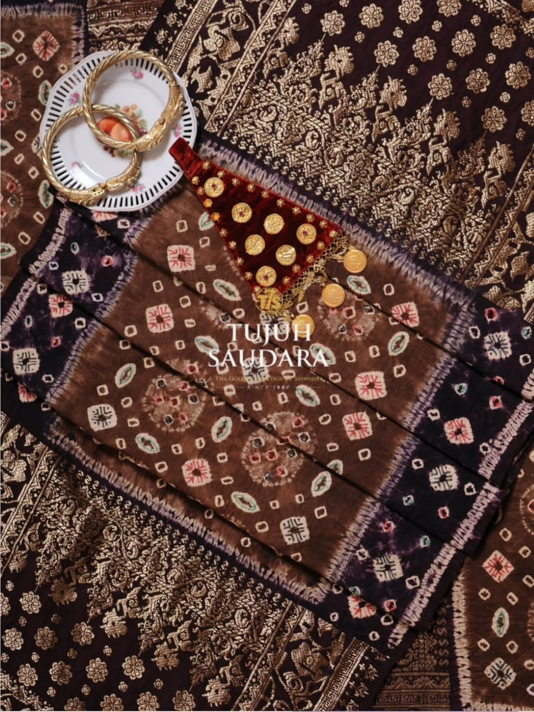 Songket jumputan motif titik tujuh